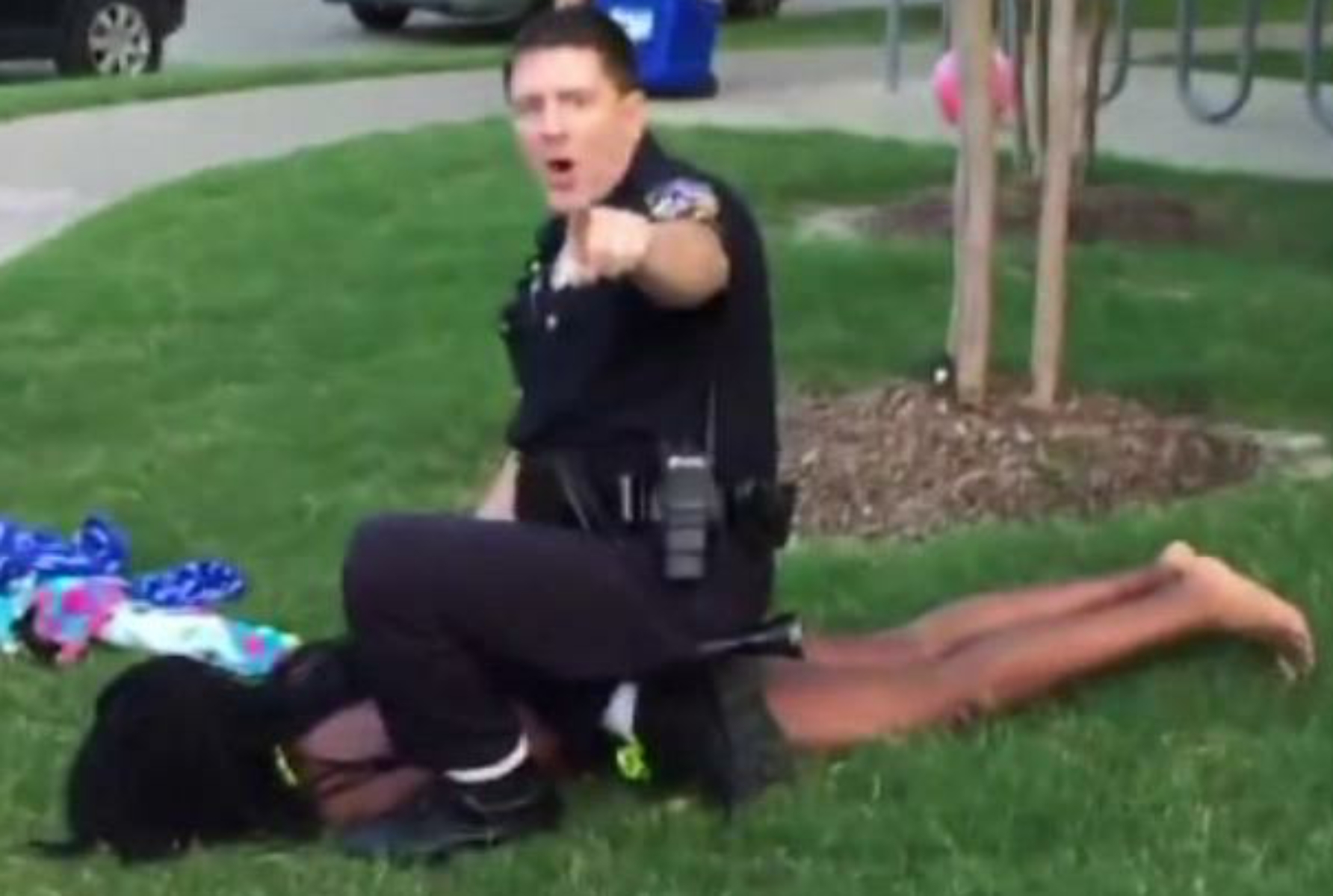 Caught on Cam: Crazy cop pulls gun on black teens, manhandles girl in bikini. He forces her to the ground, and she cries as the officer puts his full weight and both knees in her back. Despicable.